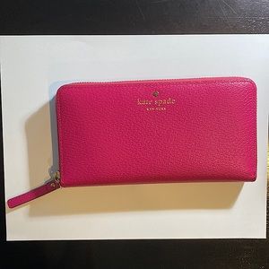 Kate Spade Zip around wallet- excellent condition. Anemone Pink/beige interior.